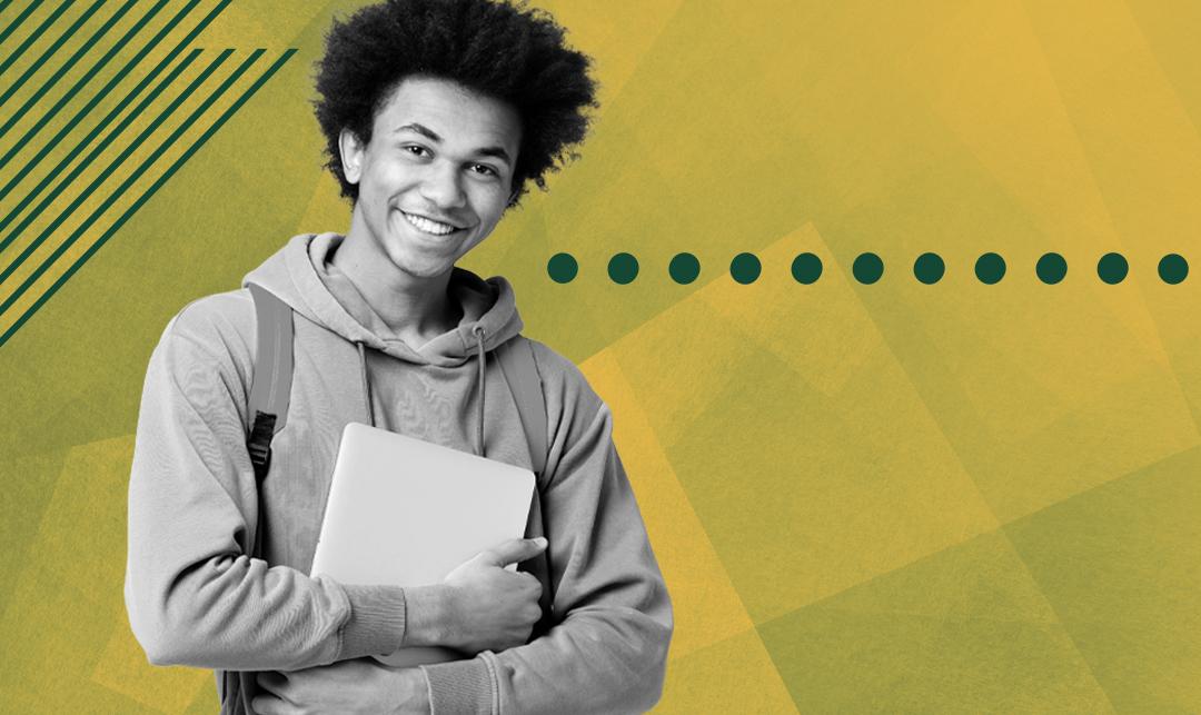 young man holding books